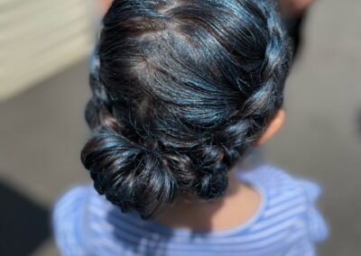 girl with a crown braid and blue sparkles